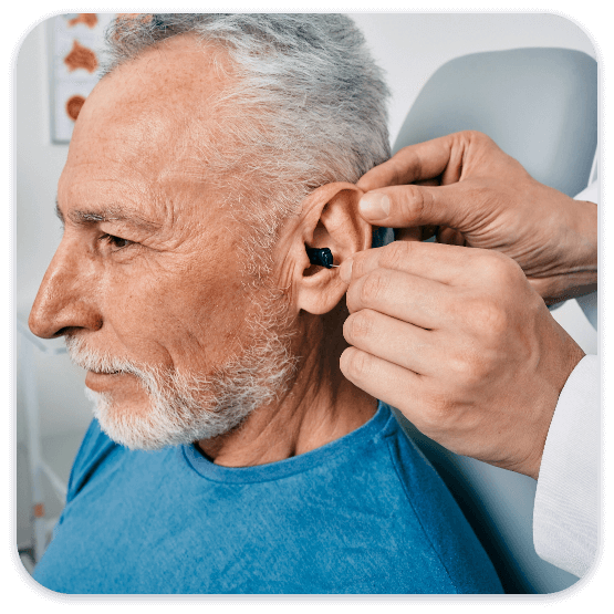 mature NJ resident getting fitted for a hearing aid